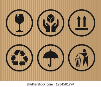 Rounded fragile symbol set on cardboard background vector image
