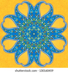 Rounded ornament based on paisley motives. Bright blue and yellow.