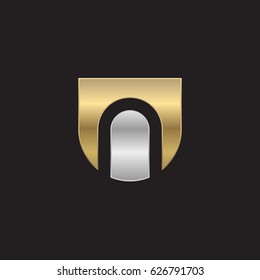 rounded shield shape n logo, Initial logo un, nu, n inside u letter, negative space logo gold silver