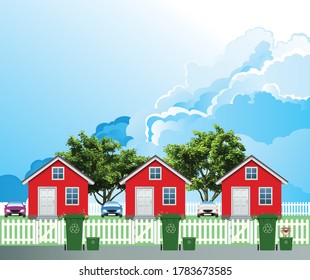 Row of detached residential homes on a suburb street with green recycling wheelie bins out ready for collection set against a blue cloudy sky