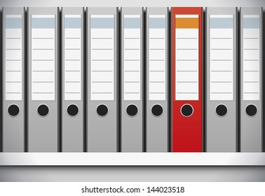 A row of folders one red colored