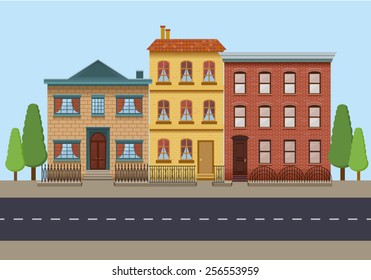 The row of three vintage houses. City background
