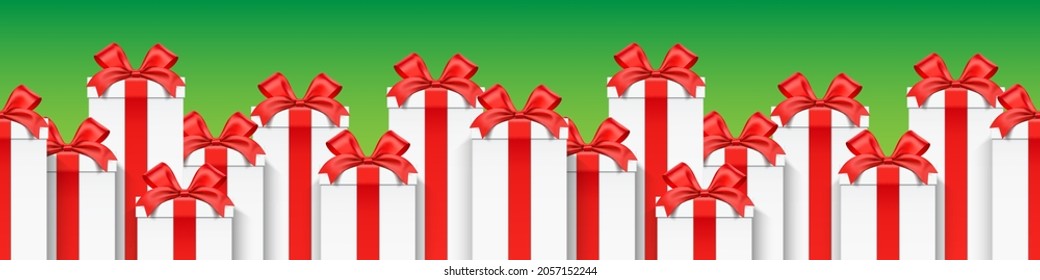 A row of white gift boxes wrapped with red ribbons, standing on a green background. Christmas holidays horizontal vector banner design.