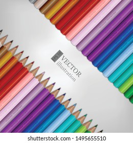 Rows of rainbow colored pencils on white background.