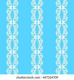 Rows of white patterns in an abstract style. White elegant pattern on a blue background.