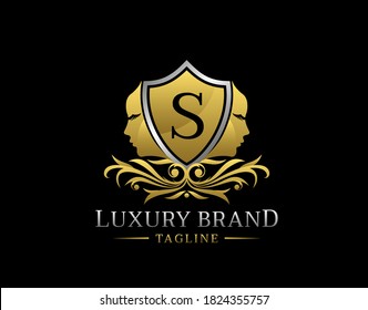 Royal Beauty Logo With S Letter. Elegant Gold Shield badge With Beauty Face Shape perfect for salon, spa, cosmetic, Boutique, Jewelry.