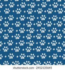 Royal blue background white paw prints and stars. Seamless fabric design pattern