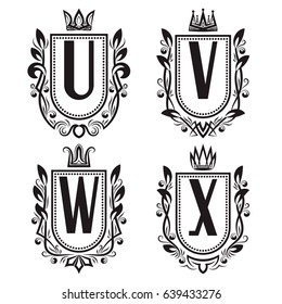 Royal coat of arms set in medieval style. Vintage logos with U, V, W, X monogram.