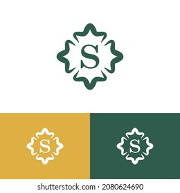 Royal premiun wreath logo design concept. Elegant logomark illustration. Can representing flower, lotus, sacred, spiritual, religion, spa, beauty, fashion.