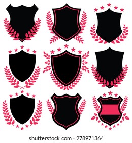 Royal shields shapes set. Vector illustration isolated on white background. Creative set of black shields, badges and labels with laurel wreaths, leaves and star signs