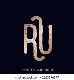RU monogram logo.Typographic icon with uppercase letter R and letter U.Lettering sign in rose gold metallic color isolated on dark background.