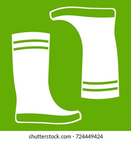 Rubber boots icon white isolated on green background. Vector illustration