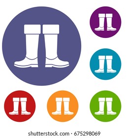 Rubber boots icons set in flat circle red, blue and green color for web