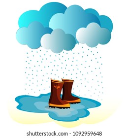 rubber boots in a puddle in the rain