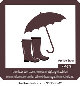 Rubber boots and umbrella