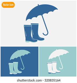 Rubber boots and umbrella vector icon.