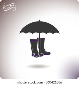 Rubber boots and umbrella vector icon.