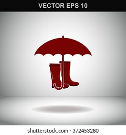 Rubber boots and umbrella vector icon.
