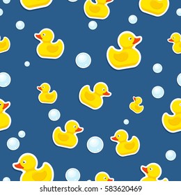 Rubber duck and bubbles seamless pattern bath toy on blue background. Vector illustration