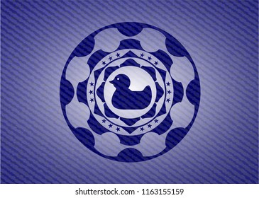 rubber duck icon inside badge with denim background