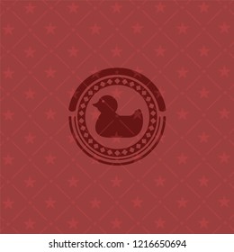 rubber duck icon inside badge with red background