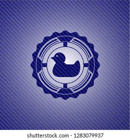 rubber duck icon inside badge with denim texture