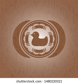 rubber duck icon inside badge with wooden background