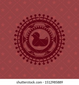 rubber duck icon inside badge with red background