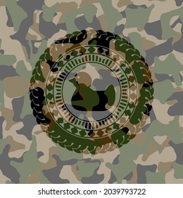 rubber duck icon inside camouflaged emblem. 