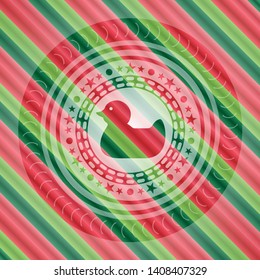 rubber duck icon inside christmas colors style badge.
