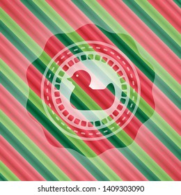 rubber duck icon inside christmas colors style badge.