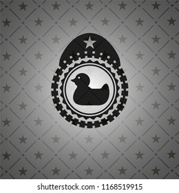 rubber duck icon inside dark badge or emblem