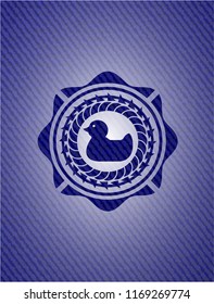 rubber duck icon inside denim background