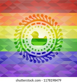 rubber duck icon inside emblem on mosaic background with the colors of the LGBT flag