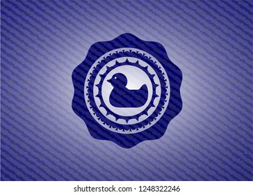 rubber duck icon inside emblem with jean high quality background