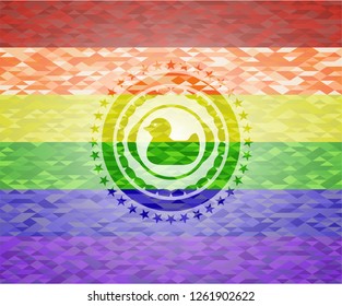 rubber duck icon inside emblem on mosaic background with the colors of the LGBT flag