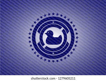 rubber duck icon inside emblem with denim texture