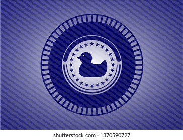 rubber duck icon inside emblem with denim high quality background