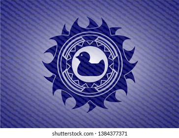 rubber duck icon inside emblem with denim texture