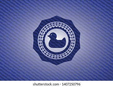 rubber duck icon inside emblem with jean high quality background