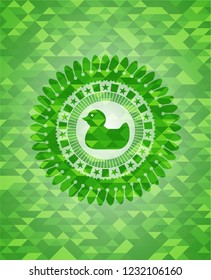 rubber duck icon inside green emblem with triangle mosaic background