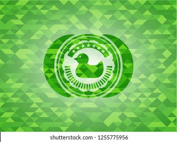 rubber duck icon inside green emblem. Mosaic background