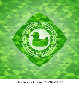 rubber duck icon inside green emblem. Mosaic background