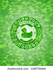 rubber duck icon inside green emblem. Mosaic background