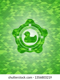rubber duck icon inside green emblem with mosaic ecological style background