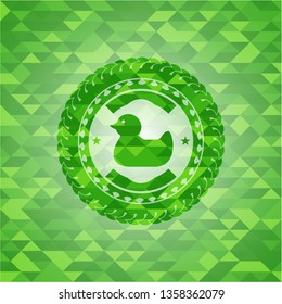 rubber duck icon inside green mosaic emblem