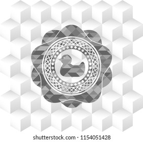 rubber duck icon inside grey emblem with geometric cube white background