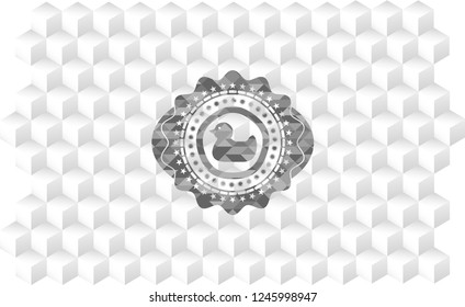 rubber duck icon inside grey badge with geometric cube white background