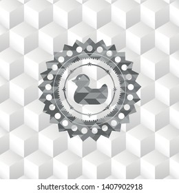 rubber duck icon inside grey badge with geometric cube white background