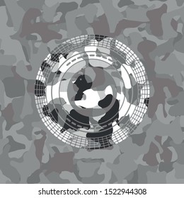 rubber duck icon inside grey camouflage emblem